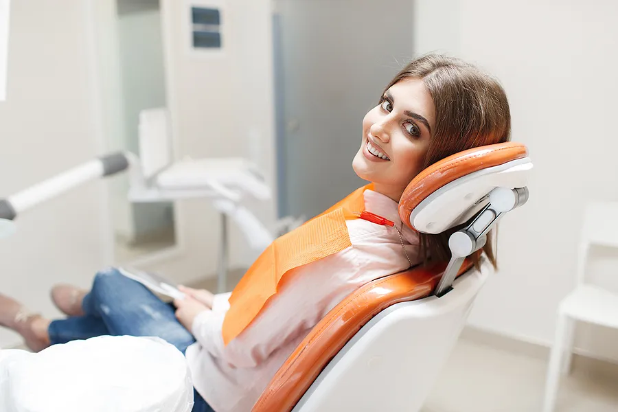 Patient smiling after dental implant treatment